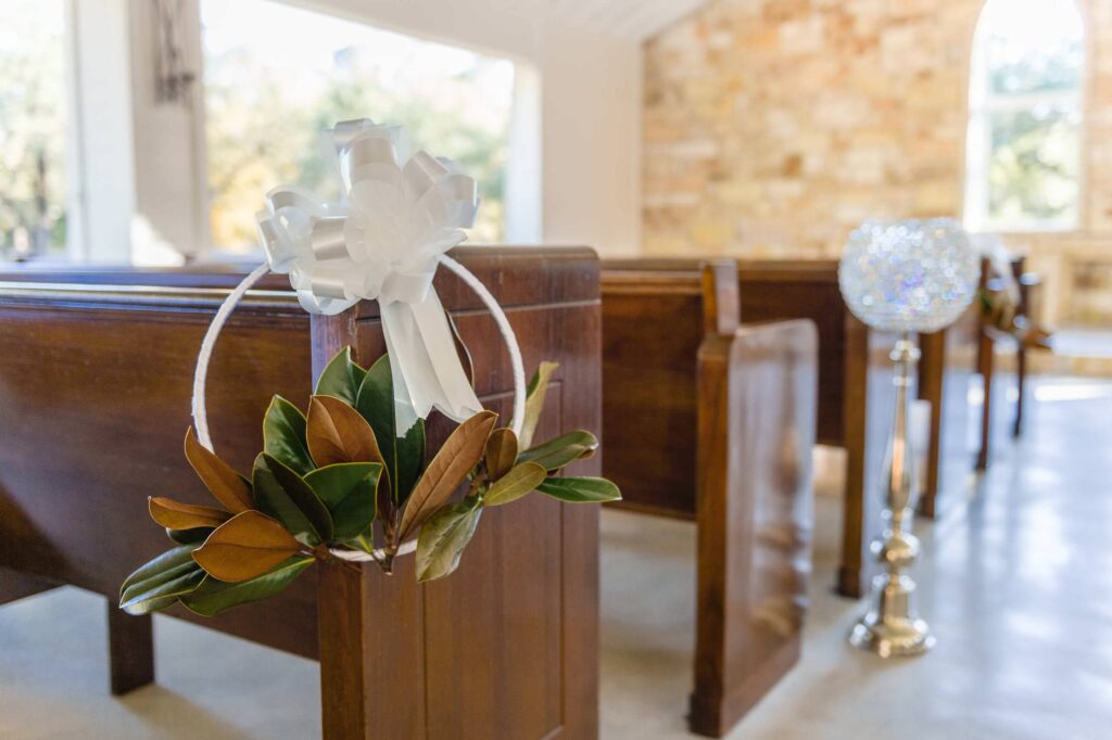 Chandelier of Gruene winter wedding pew floral markers