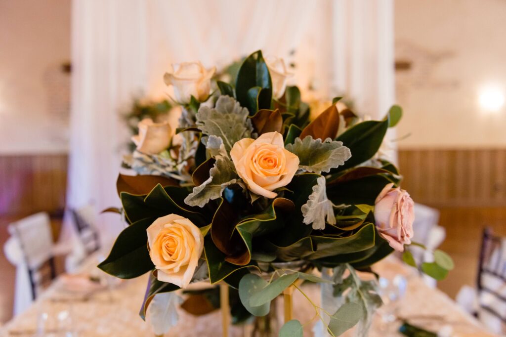 Chandelier of Gruene winter wedding table centerpiece with magnolia leaves