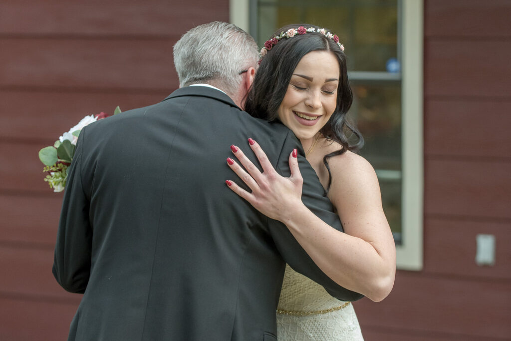 father and daughter have a pre-wedding ceremony first look