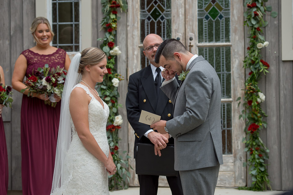 groom getting emotional as he recites his vows during the wedding ceremony