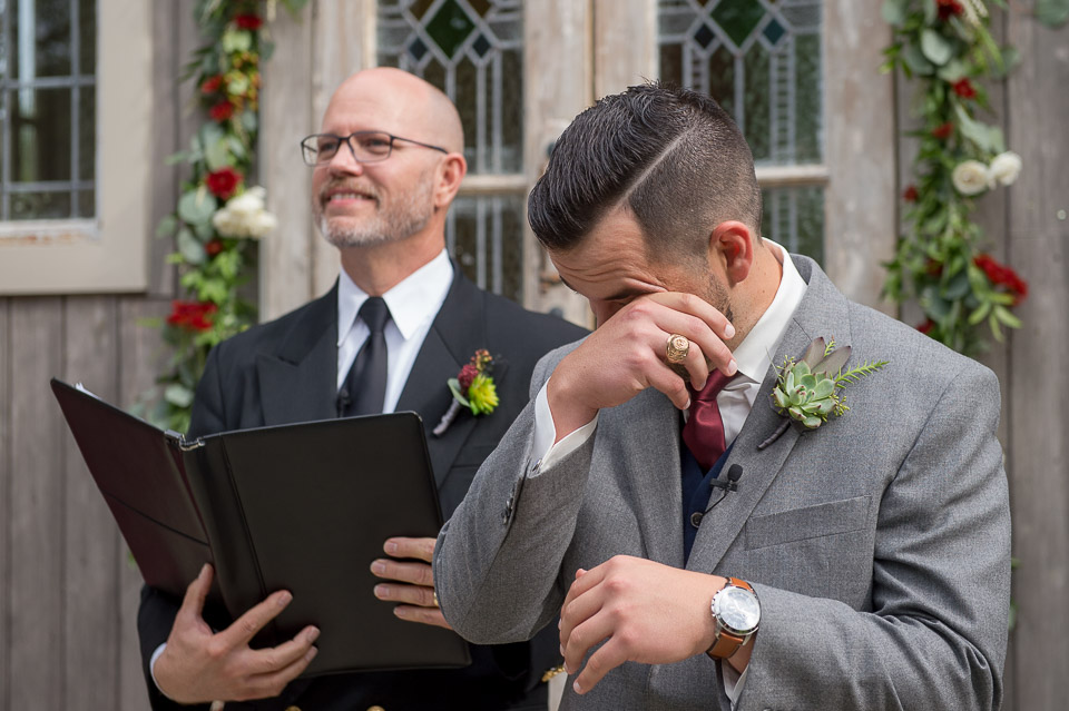 groom getting emotional watching his bride's processional