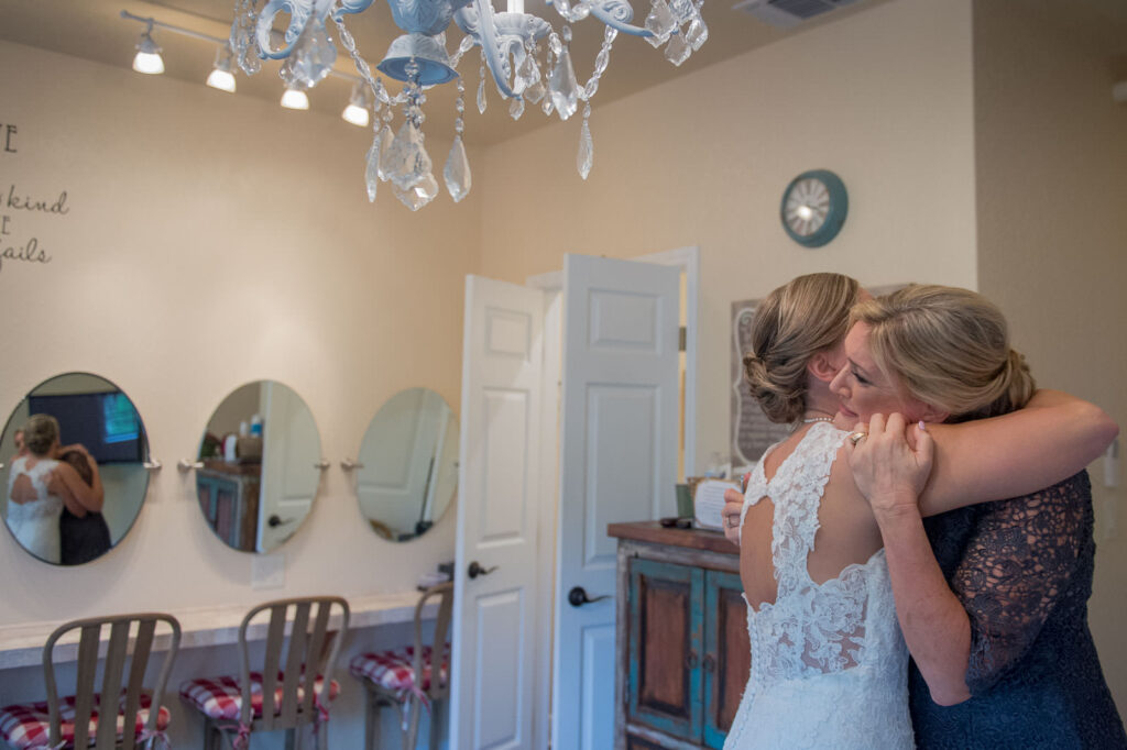 mom and daughter having a very private moment before the wimberley wedding ceremony