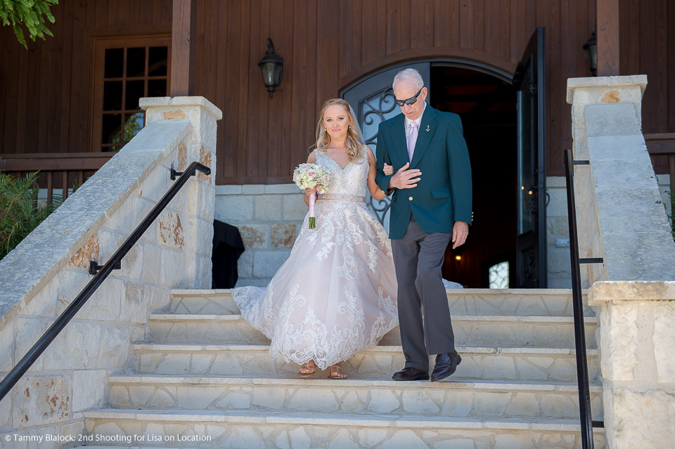 grandfather walking bride down the aisle in the wedding processional