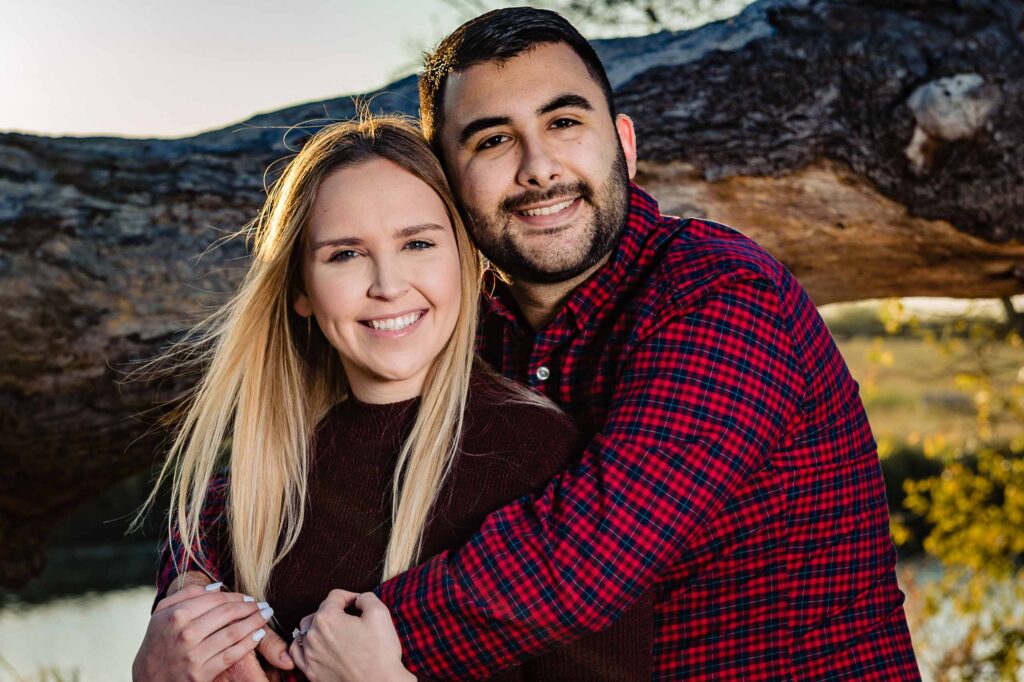 closeup shot of a couple hugging and facing the camera during their country engagement session by San Antonio TX Wedding Photographer Tammy Blalock, Ata-Girl Photography Co.