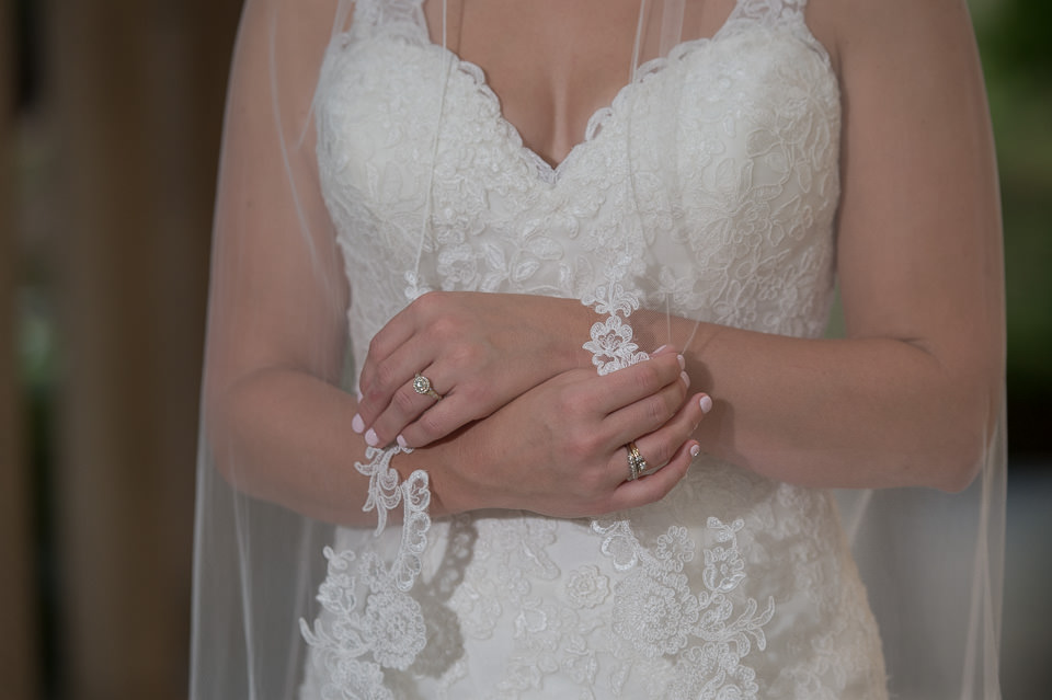 landa library bridal session closeup image of bride's arms folded across her chest showing both of her grandmother's wedding rings by San Antonio TX Wedding Photographer Tammy Blalock, Ata-Girl Photography Co.