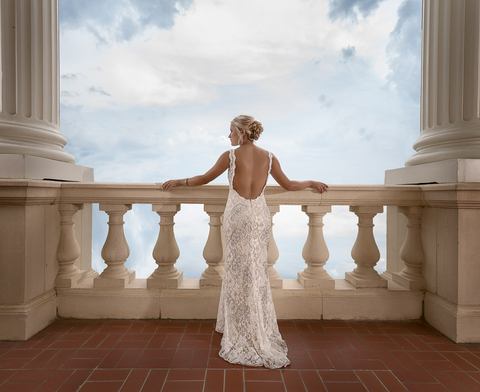 fine art image back of a bride with her head turned revealing her profile overlooking a balcony by San Antonio TX Wedding Photographer Tammy Blalock, Ata-Girl Photography Co.