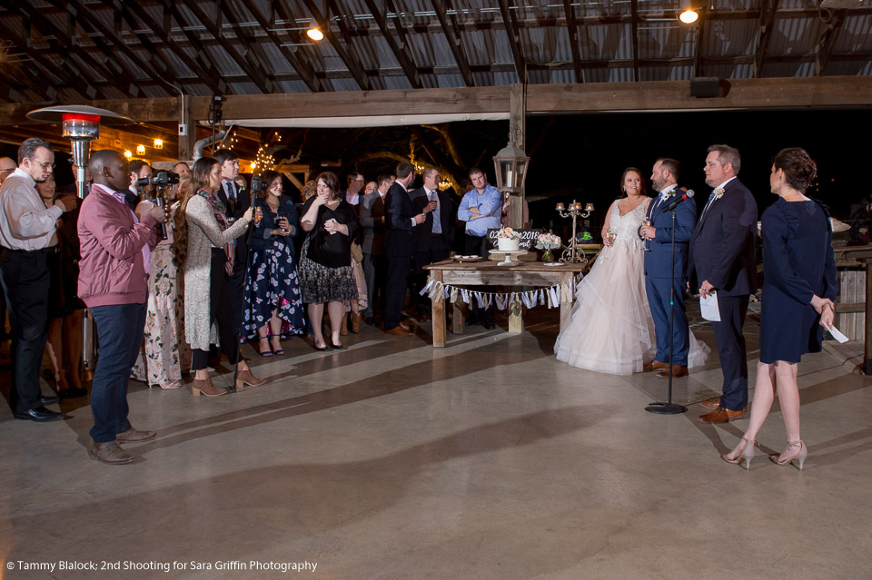 two videographers filming the toasts during a wedding reception at gruene estate in new braunfels, texas by San Antonio TX Wedding Photographer Tammy Blalock, Ata-Girl Photography Co.