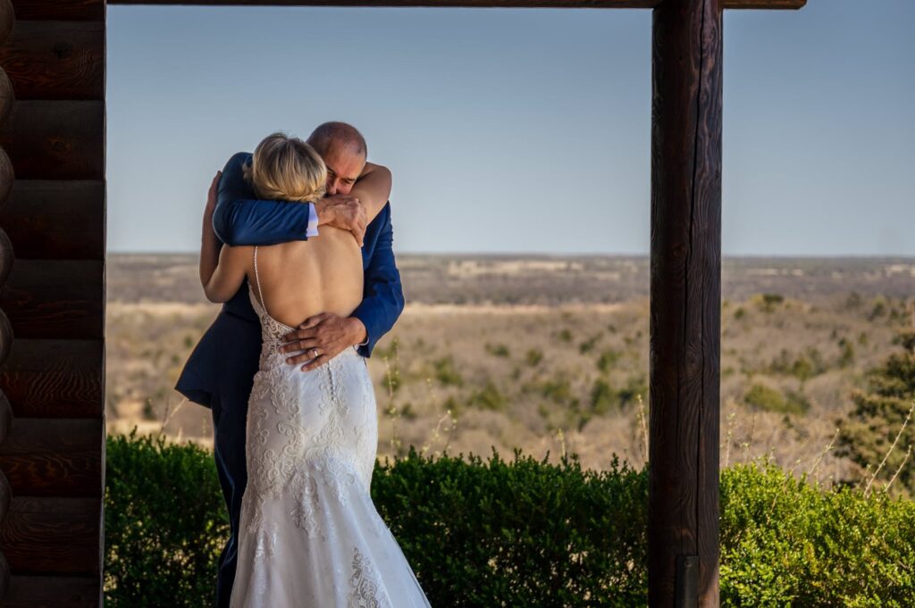 bride's first look with dad on wedding day overlooking the red river, documentary dallas wedding photographer